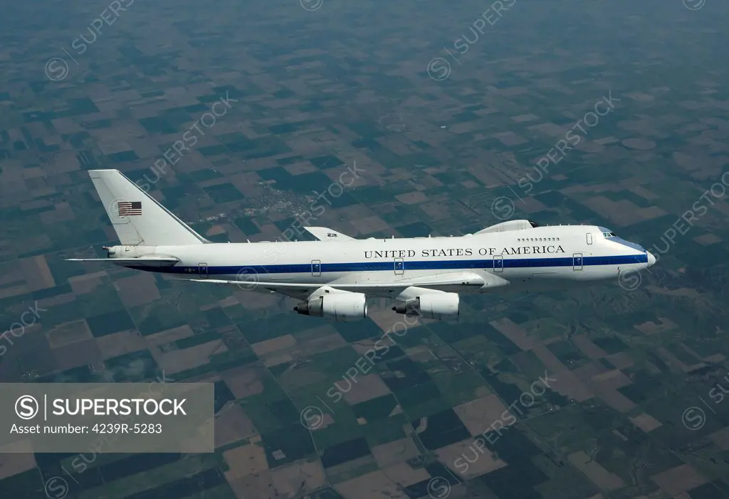 An E-4B National Airborne Operations Center (NAOC) aircraft flies high over the Midwest on a training mission out of Offutt Air Force Base, Nebraska.