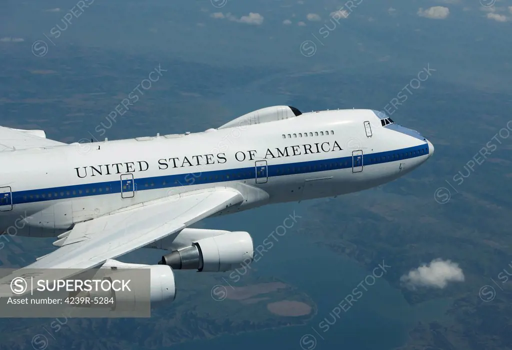 An E-4B National Airborne Operations Center (NAOC) aircraft flies high over the Midwest on a training mission out of Offutt Air Force Base, Nebraska.