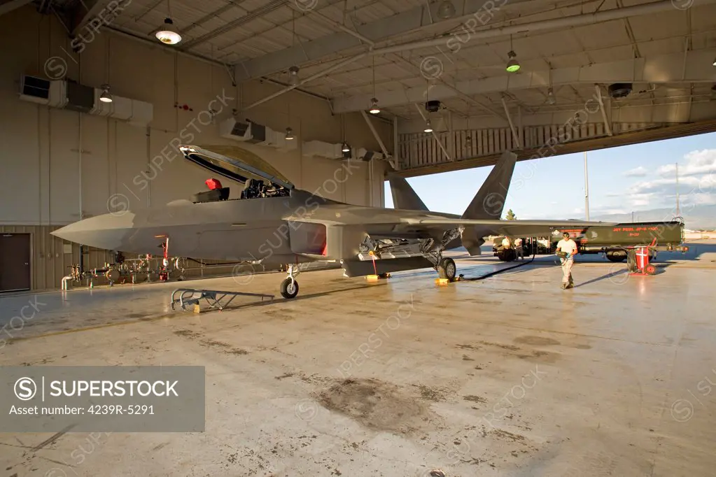 Maintence personnel from the 49th Fighter Wing at Holloman Air Force Base, New Mexico, prepare to refuel an F-22 Raptor.