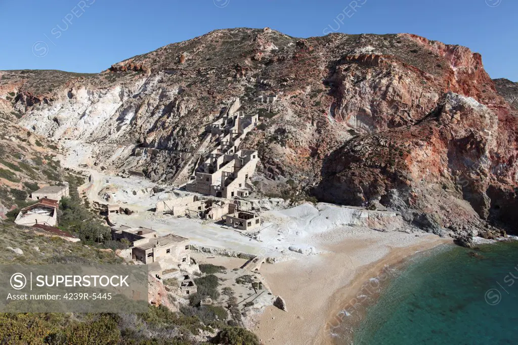 Paliorema (alt. Paleorema) historic Sulfur Mine and processing facility, Milos Island, Greece. Sulfur processing facility employing Svoronos process for extracting sulfur from ore. View including bay and valley.