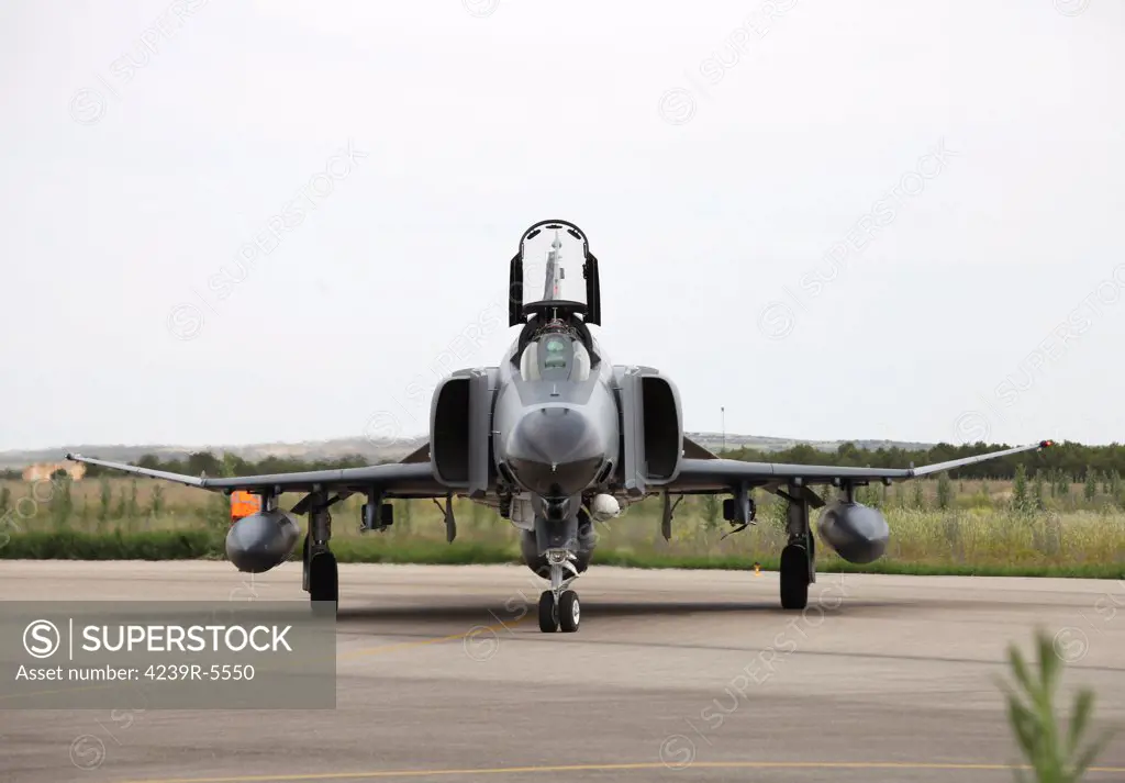 Front view of a Turkish Air Force F-4E Phantom with laser designator pod at Albacete Airfield, Spain.