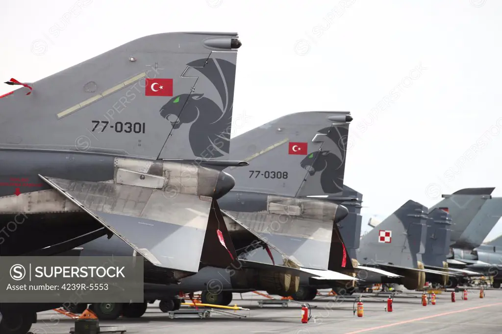Turkish and Polish aircraft tails at NATO's Tactical Leadership Program exercise, Albacete Airfield, Spain.