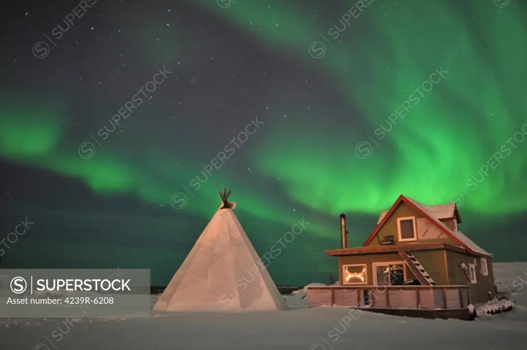 Northern Lights above village, Northwest Territories, Canada.