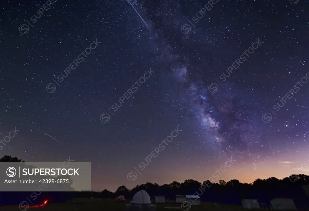 Two Perseid meteors streak across the Milky Way during the 2012 meteor shower in Oklahoma.