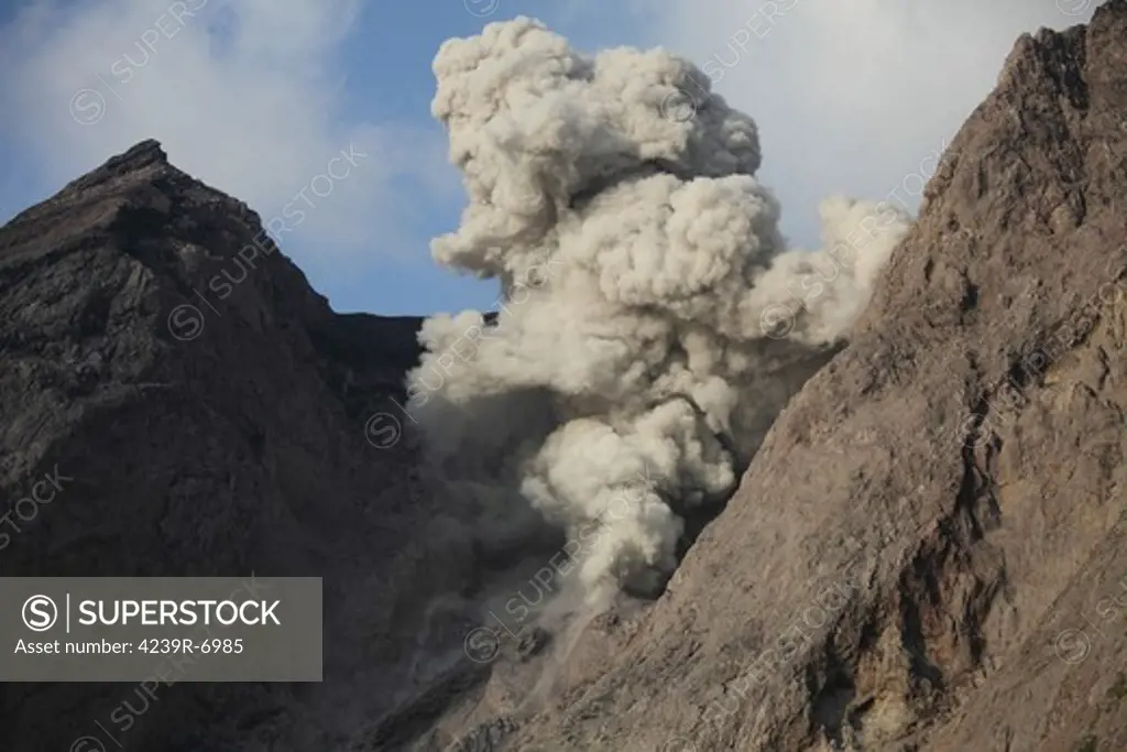 November 27, 2012 - Ash cloud from explosive strombolian eruption rising from active crater of Batu Tara volcano, Komba Island, Indonesia.