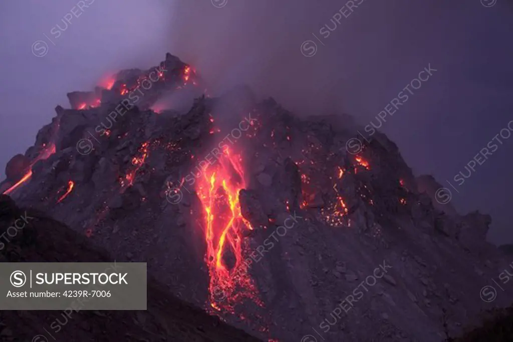 November 30, 2012 - Glowing Rerombola lava dome with incandescent rockfall deposit, Paluweh volcano, Flores, Indonesia.