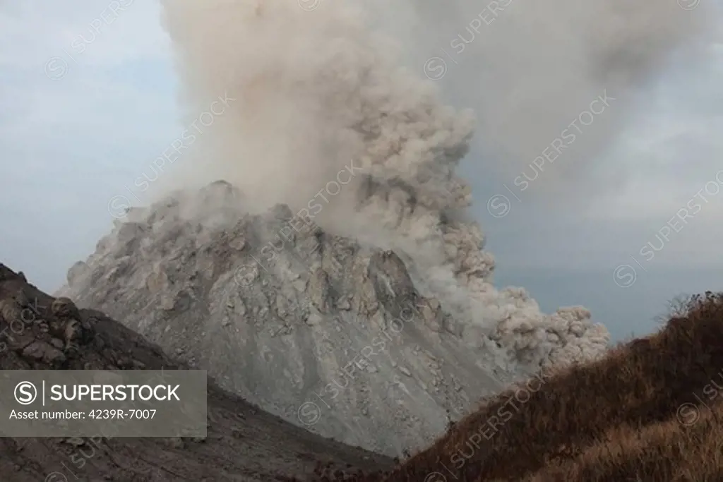 December 1, 2012 - Pyroclastic flow descending flank of Rerombola lava dome of Paluweh volcano, Flores, Indonesia.