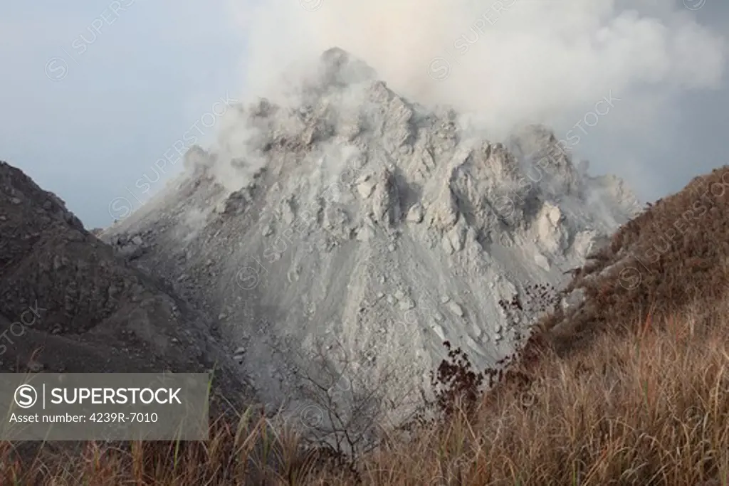 December 1, 2012 - Rerombola lava dome of Paluweh volcano during eruption in 2012, Flores, Indonesia.