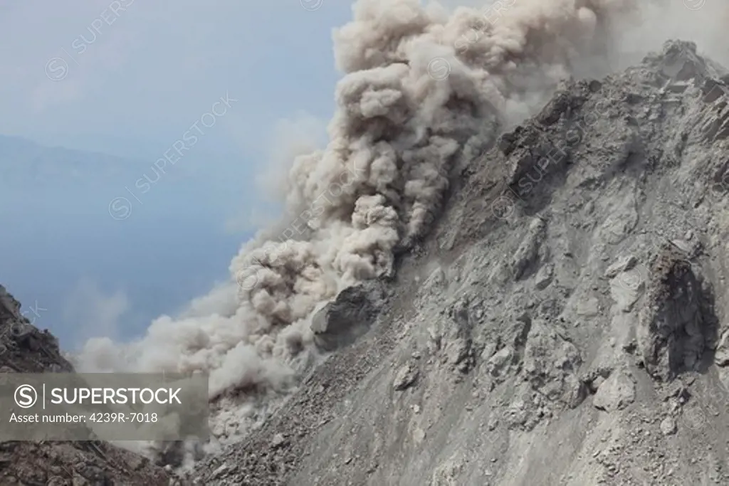December 1, 2012 - Small pyroclastic flow on flank of Rerombola lava dome of Paluweh volcano during 2012 eruption, Flores, Indonesia.