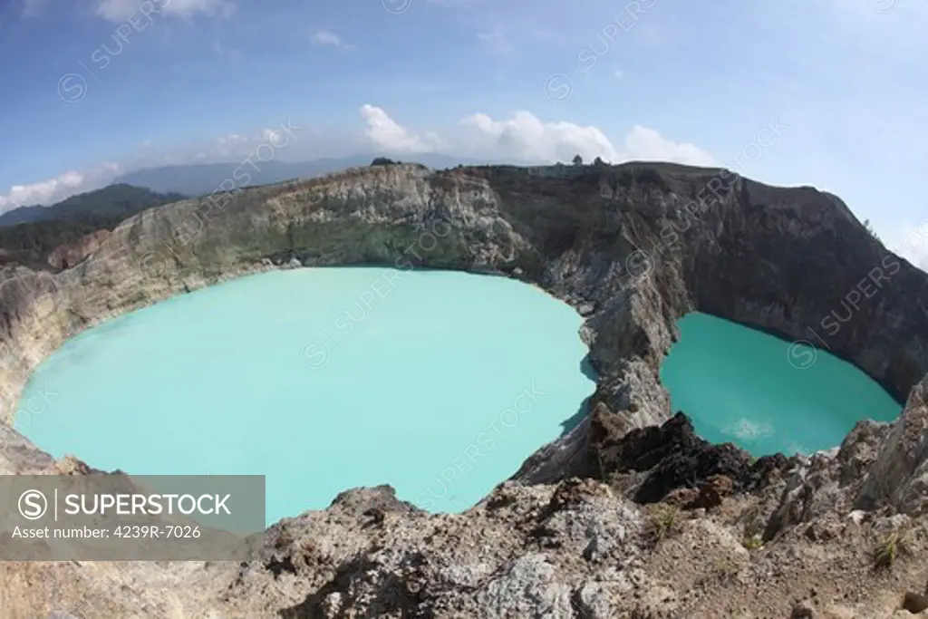 December 3, 2012 - Colourful crater lakes of Kelimutu volcano, Flores Island, Indonesia. Tiwu Nua Muri Koo Fai (Lake of Young Men and Maidens) and Tiwu Ata Polo (Bewitched Lake). The two lakes are highly acidic due to underwater fumarole activity and are turqoise in colour.