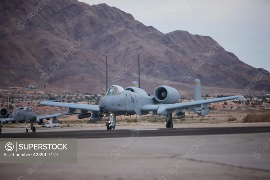 A-10 Thunderbolts taxi to the runway at Nellis Air Force Base, Nevada, during the 2013 Red Flag Exercise.