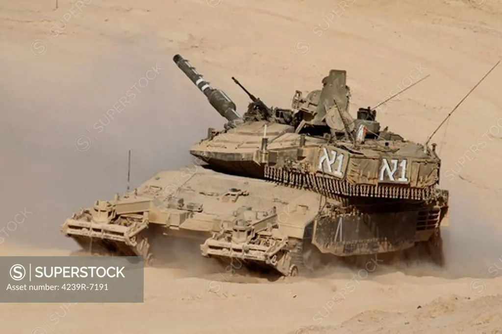 An Israel Defense Force Merkava Mark IV main battle tank with mine clearing device attached to its front.