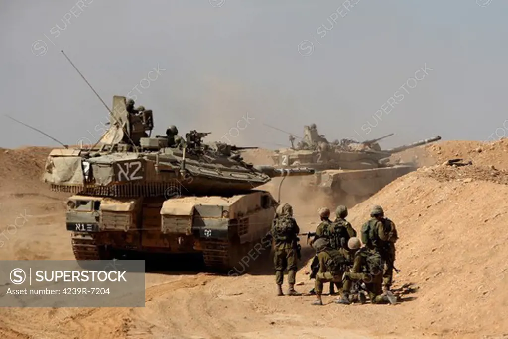 An Israel Defense Force Merkava Mark IV main battle tank exercise with infantry forces.