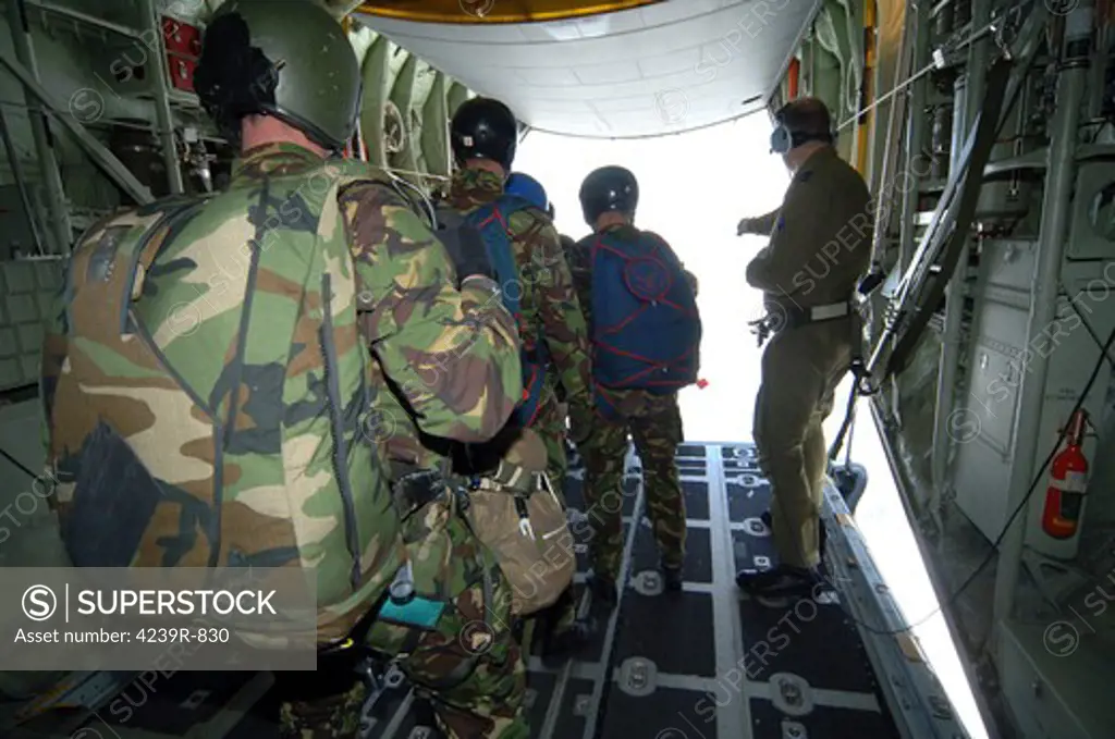 Members of the Pathfinder Platoon wait for parachute jump training aboard a C-130 Hercules