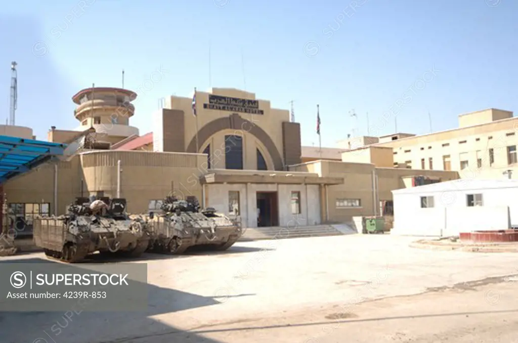 British Army MCV-80 Warrior infantry fighting vehicles parked outside headquarters in Iraq