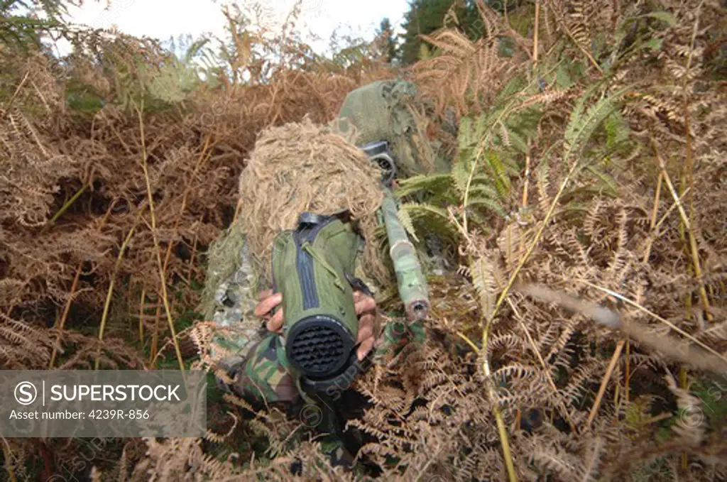 A British Army sniper team dressed in ghillie suits