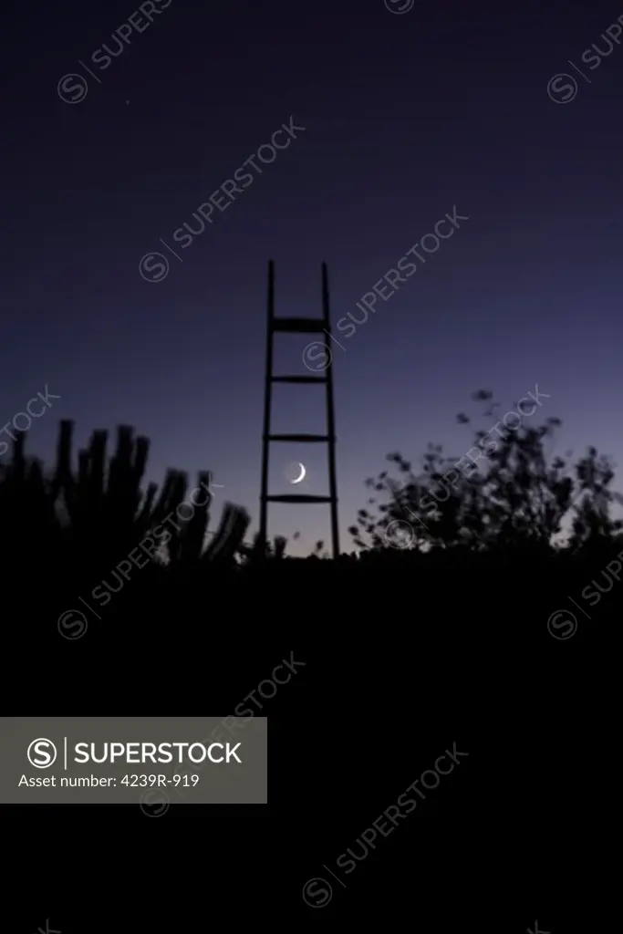 The crescent moon between the stairs, photographed from Vila Boim, Alentejo, Portugal