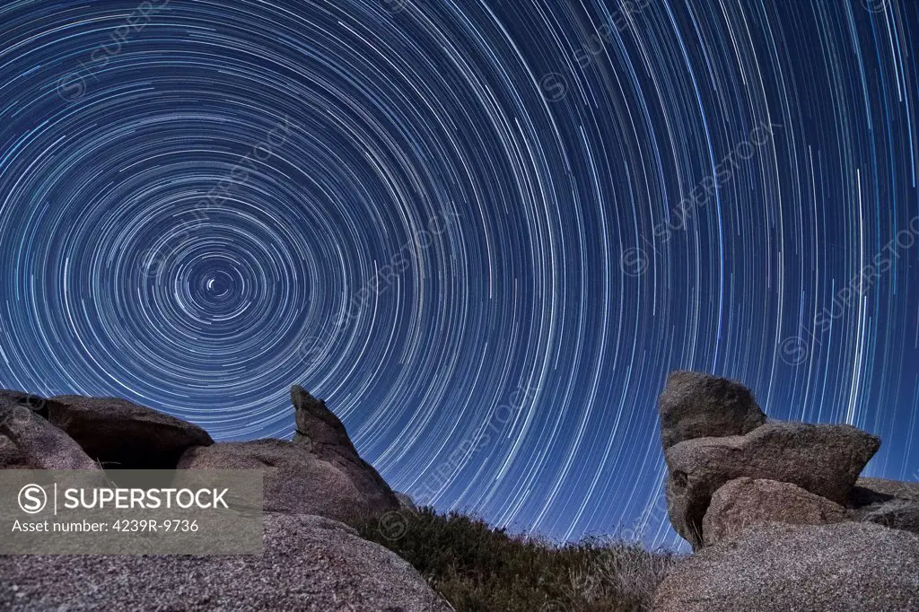 A boulder outcropping and star trails in the high desert of Anza Borrego Desert State Park, California.