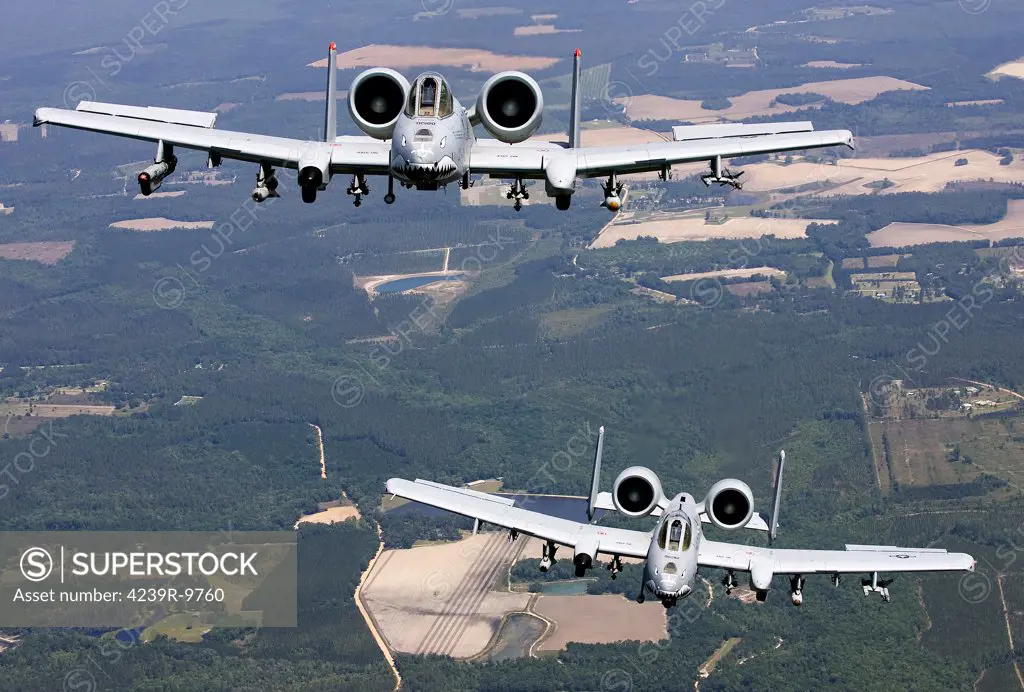 Two A-10C Thunderbolt aircraft of the 23rd Fighter Group Flying Tigers form up behind a HC-130P before heading to the Grand Bay Range near Moody Air Force Base, Georgia.