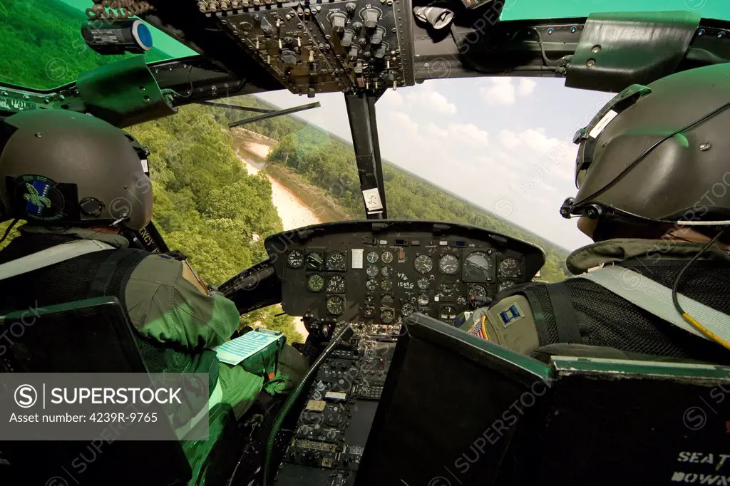 Two veteran instructor pilots of the 23rd Flying Training Squadron practice low flying operations in a UH-1H Huey south of Fort Rucker, Alabama.