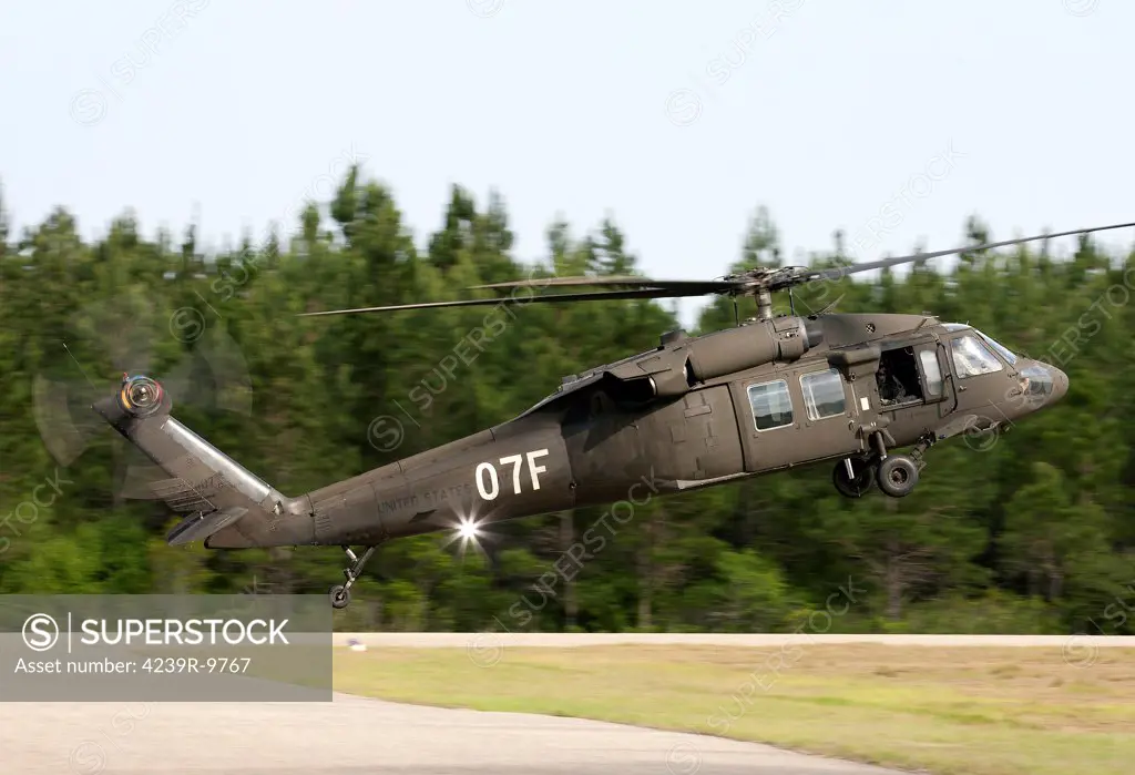 U.S. Army UH-60L Blackhawk helicopter landing at Florida Airport to refuel.