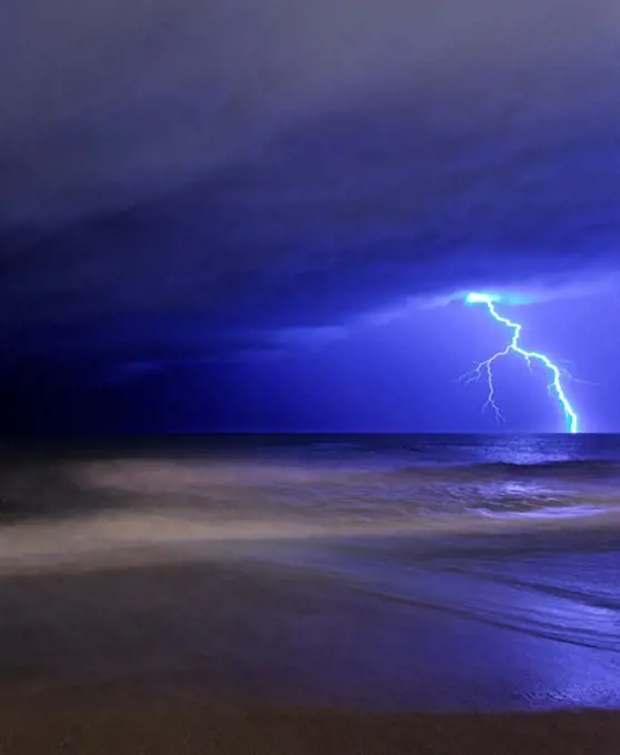 A bolt of lightning from an approaching storm at the beach in Miramar, Argentina.