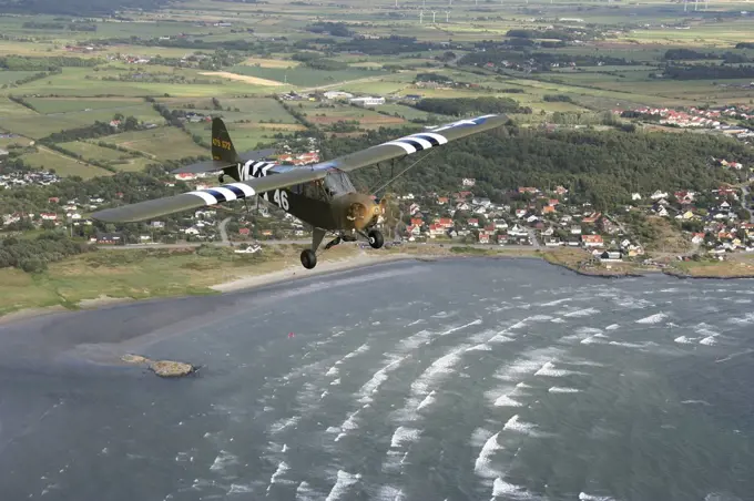 Varberg, Sweden - Piper L-4 Cub in US Army D-Day colors.Varberg, Sweden - Piper L-4 Cub in US Army D-Day colors.