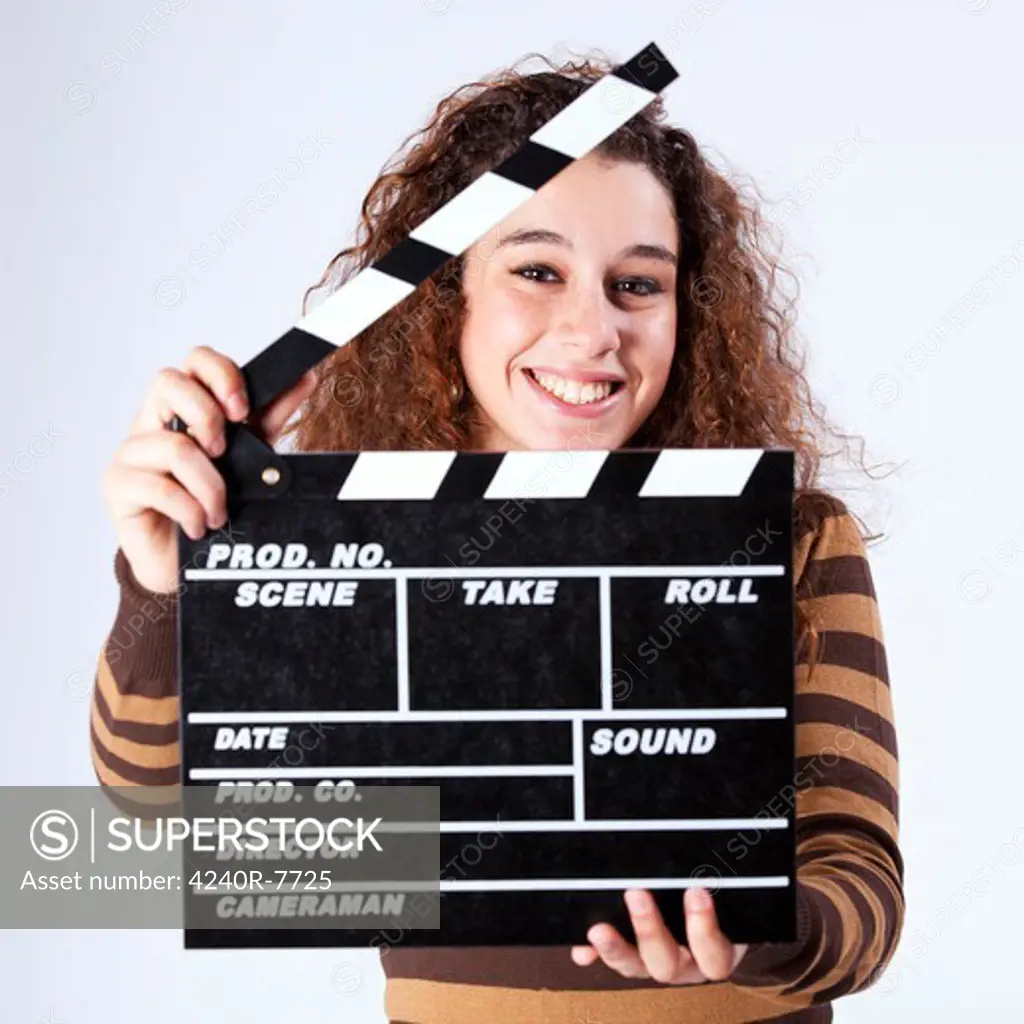 Happy Woman Holding A Movie Clapper