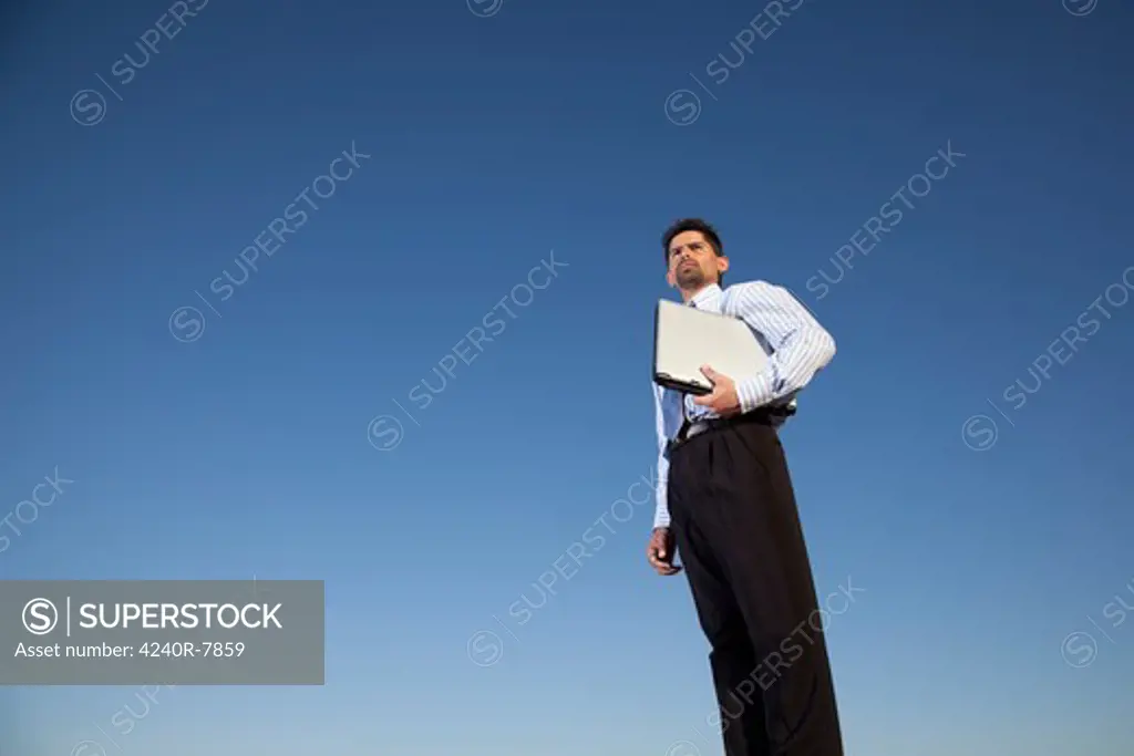 Businessman Holding A Laptop In Outdoor