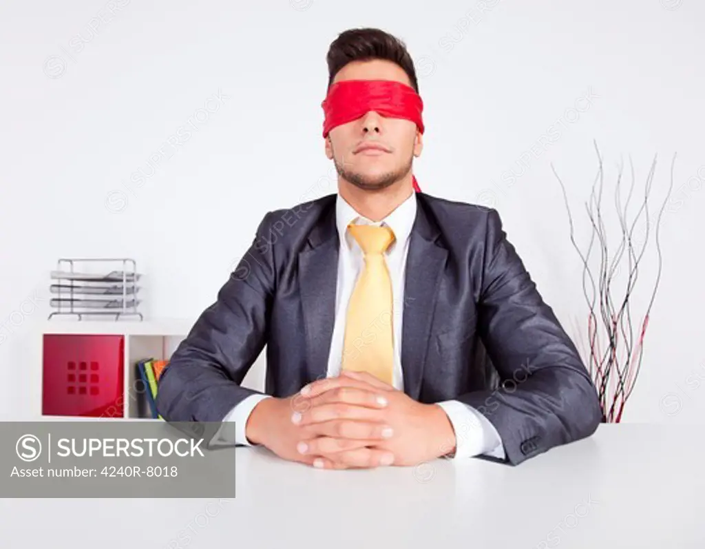 Businessman At His Office With Scarf Covering His Eyes