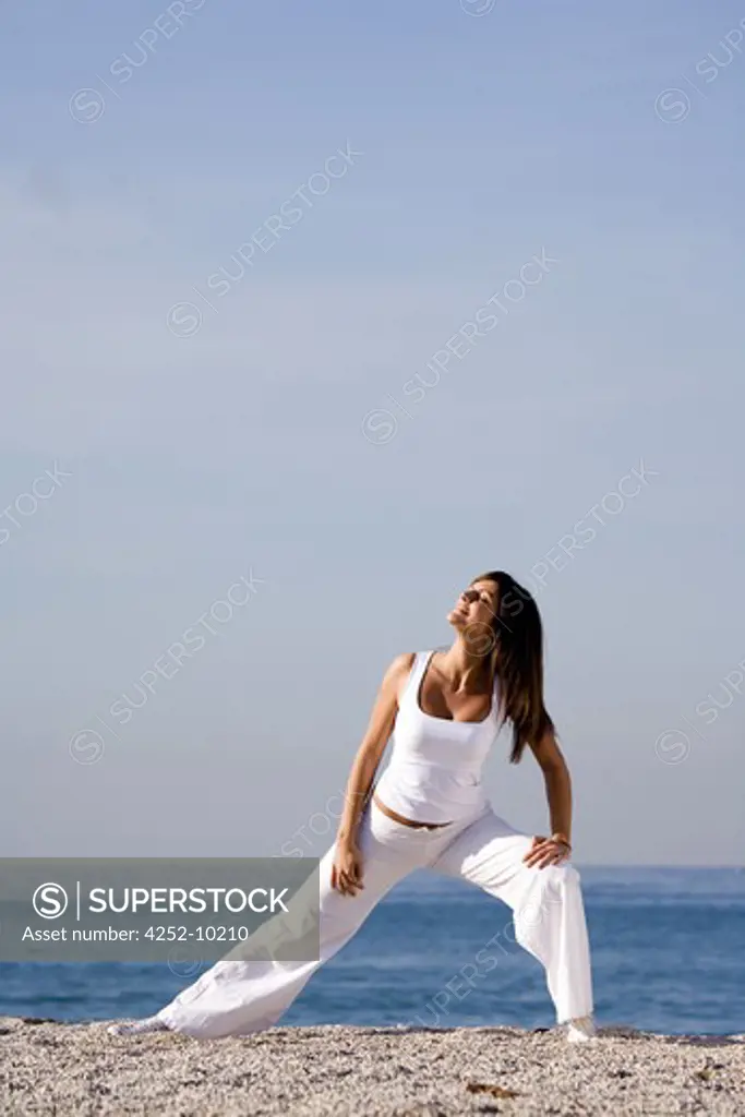 Woman beach streching