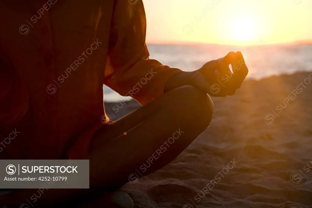 Woman beach yoga.