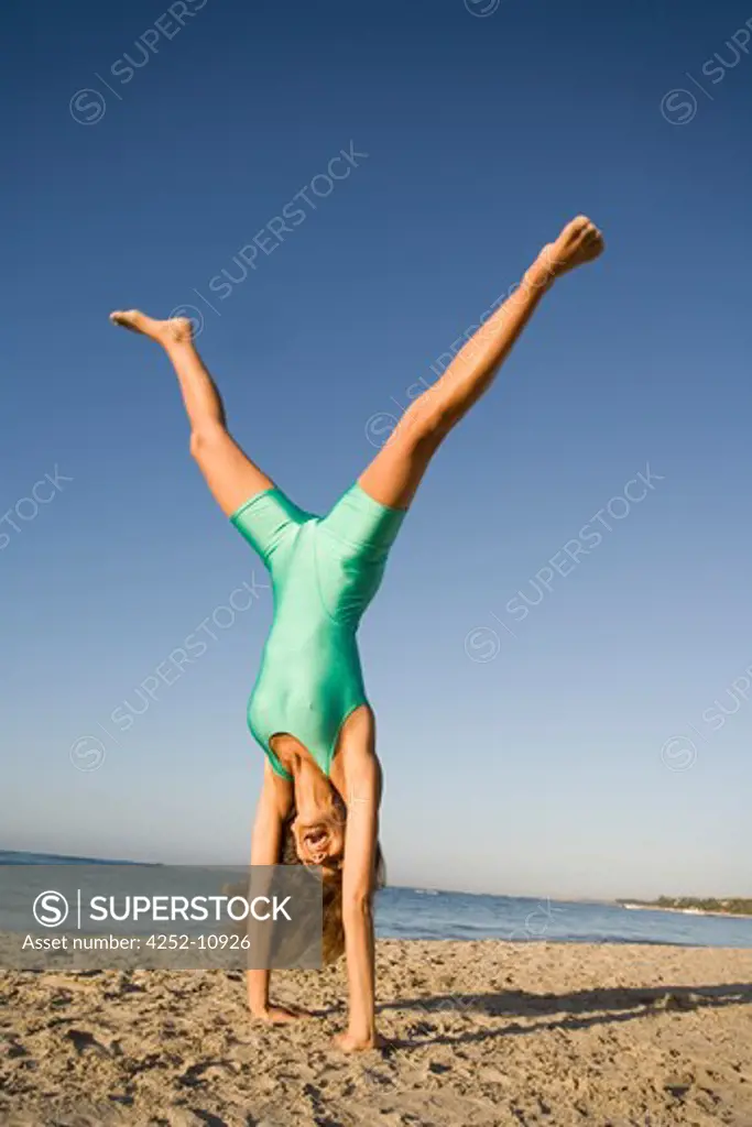 Woman beach gymnastics.