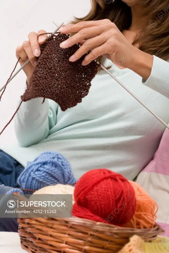 Woman knitting.