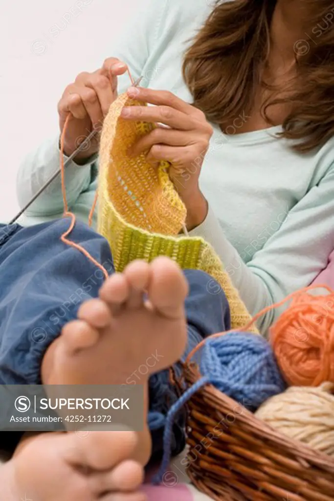 Woman knitting.