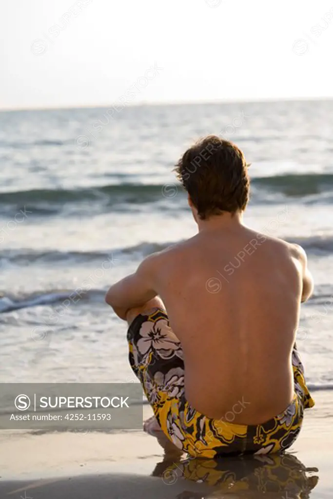 Contemplative man beach
