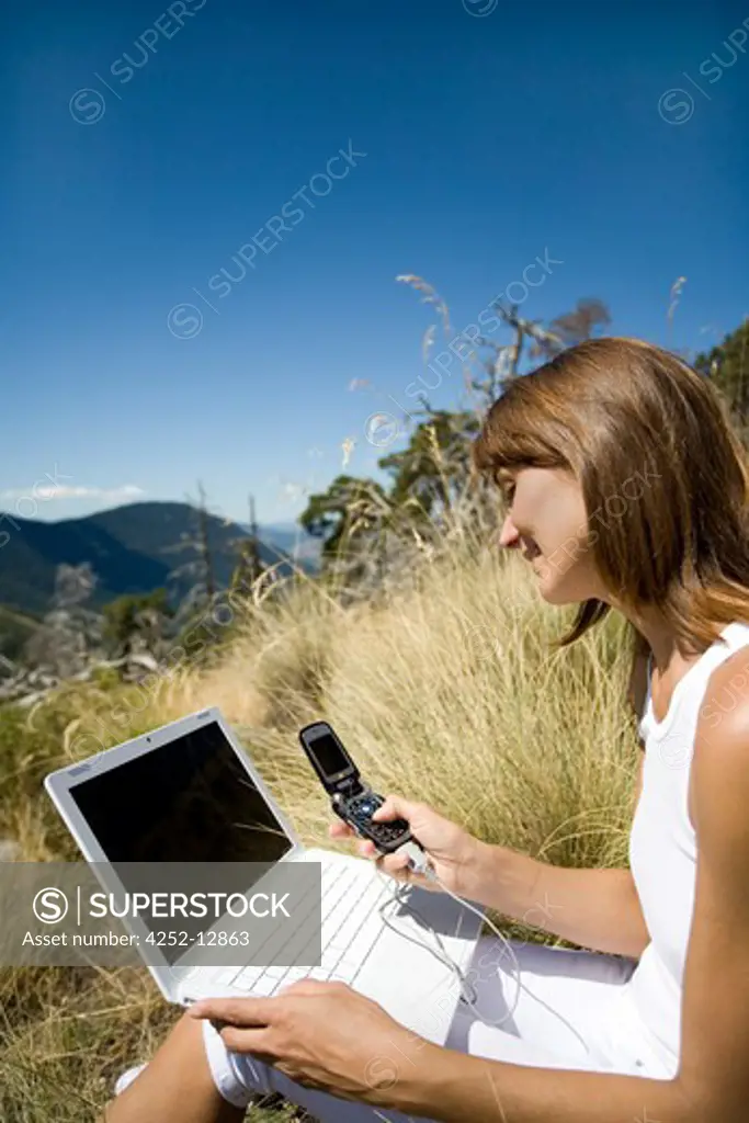 Woman nature laptop.
