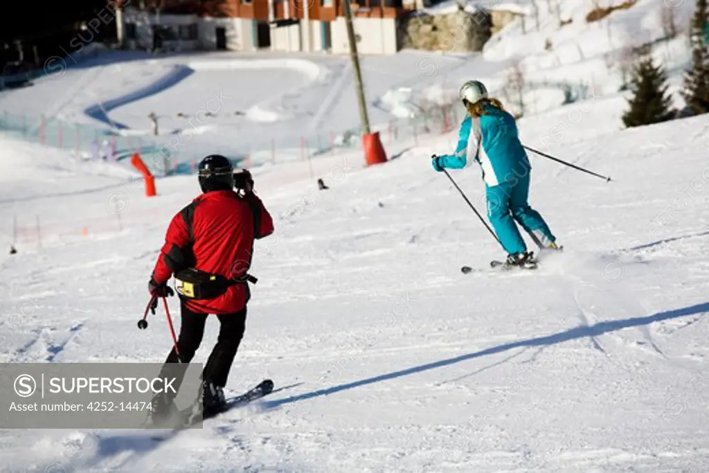 Skiers run