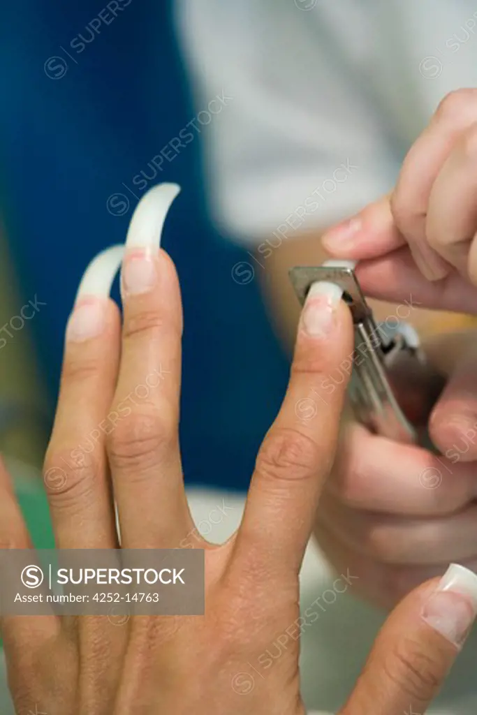 Beautician fake nails cut