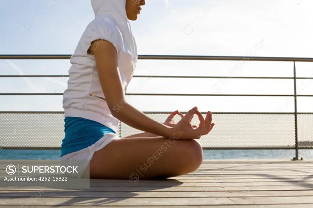 Woman yoga sea.
