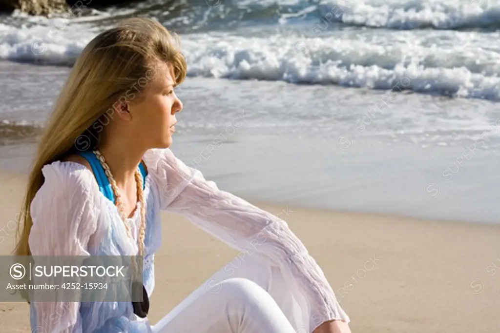 Contemplative woman sea