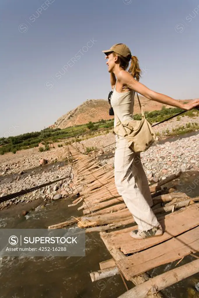 Woman chain bridge marocco
