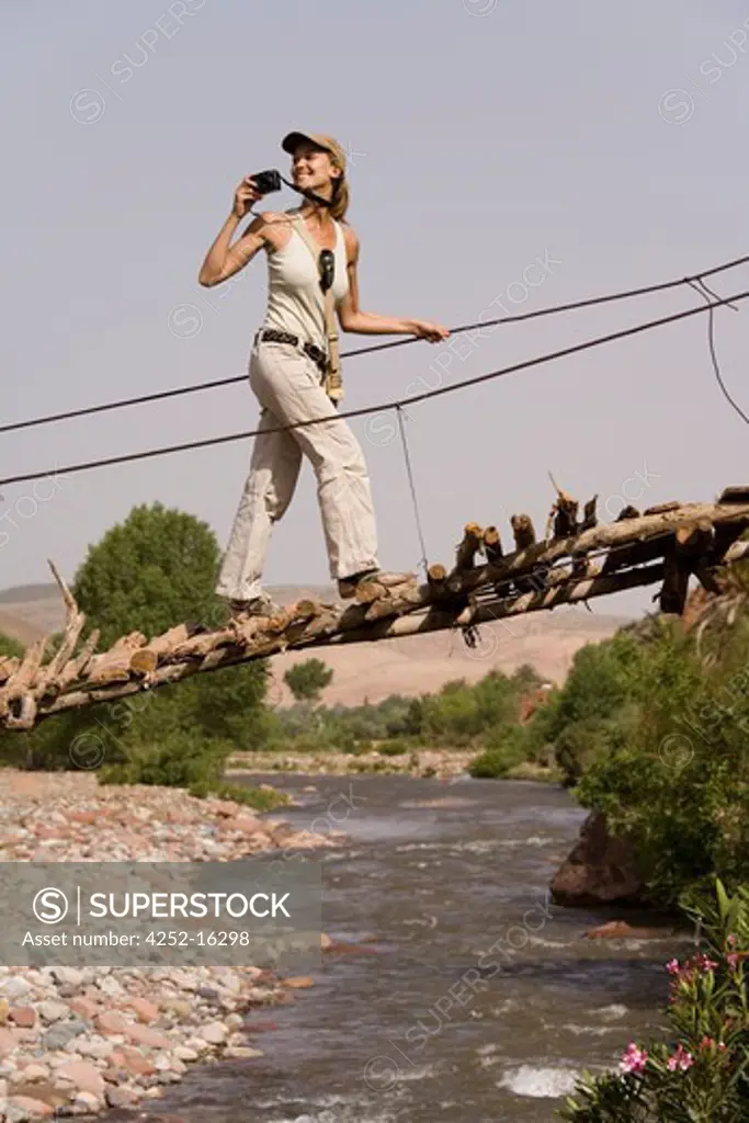 Woman chain bridge marocco