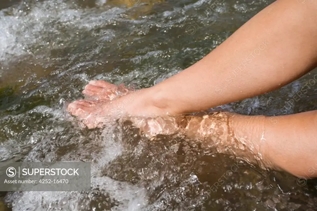 Woman river feet