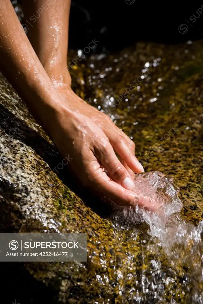 Woman hands waterfall