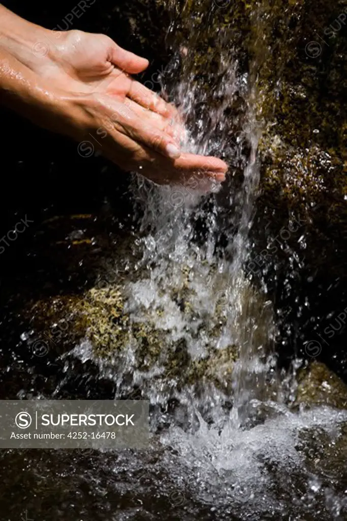 Woman hands waterfall