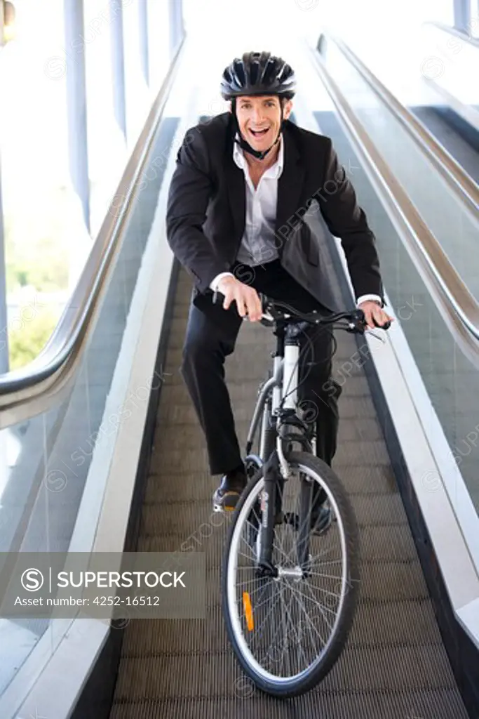 Man bike escalator