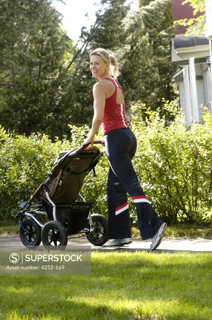 Woman with a push chair