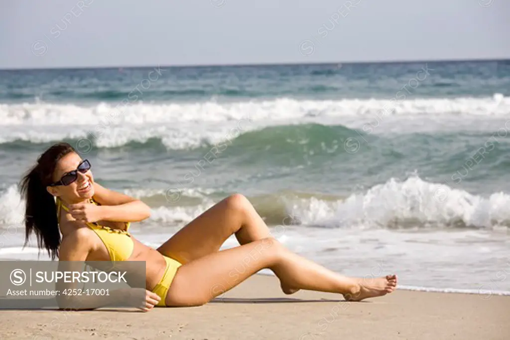 Woman suntanning beach