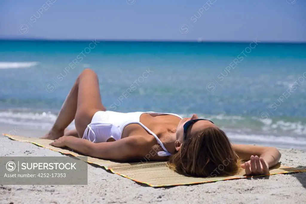 Woman beach suntanning